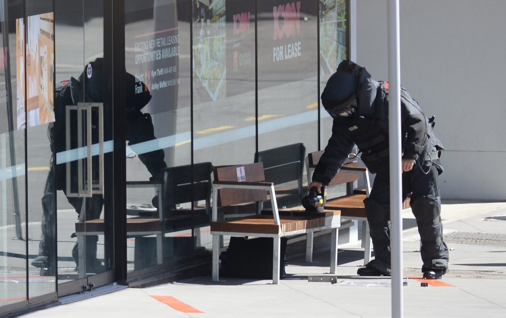 Police bomb squad inspects a suspicious package left under a seat in Bell Street on Monday morning. Photo: Rob Williams / The Queensland Times Police bomb squad inspects a suspicious package left under a seat in Bell Street on Monday morning. Photo: Rob Williams / The Queensland Times